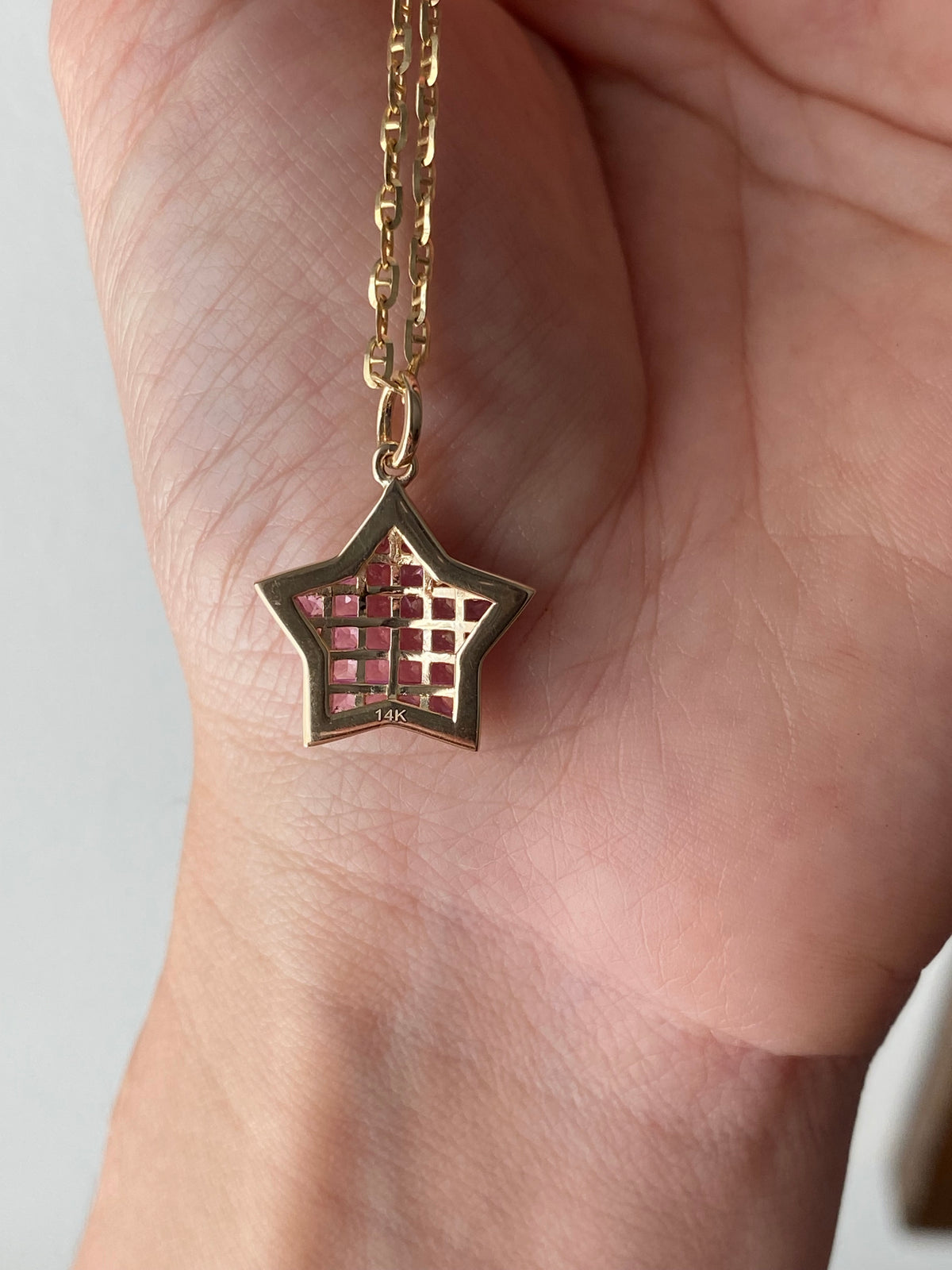 The WISH: 14k invisible set pink sapphire star pendant