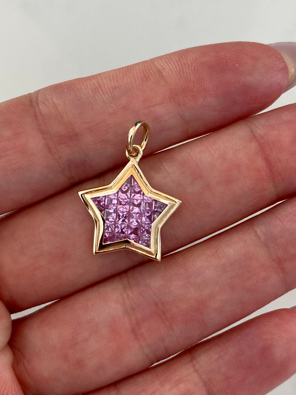 The WISH: 14k invisible set pink sapphire star pendant