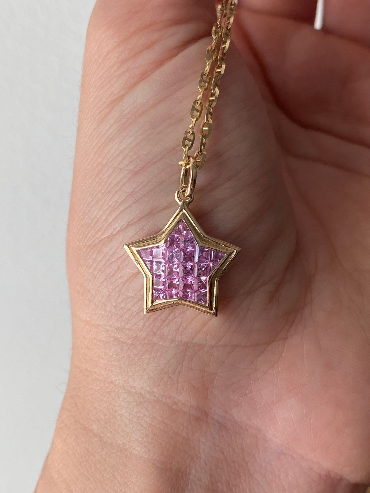 The WISH: 14k invisible set pink sapphire star pendant