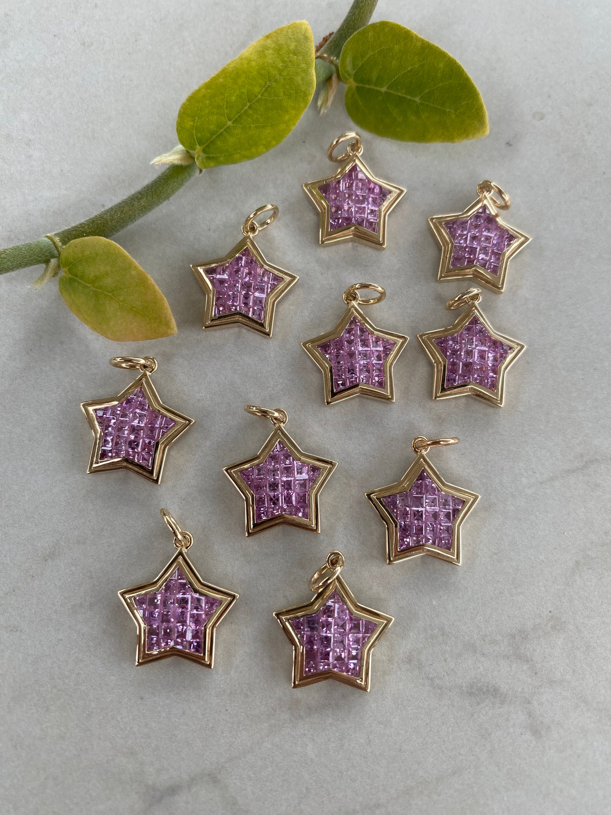 The WISH: 14k invisible set pink sapphire star pendant