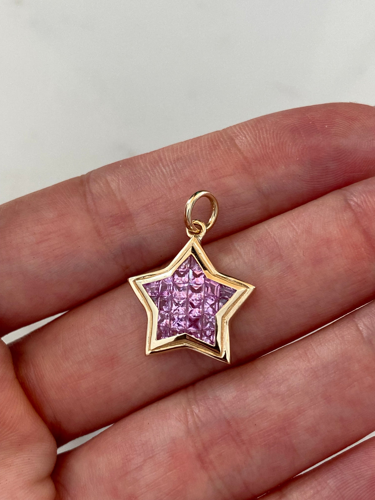 The WISH: 14k invisible set pink sapphire star pendant