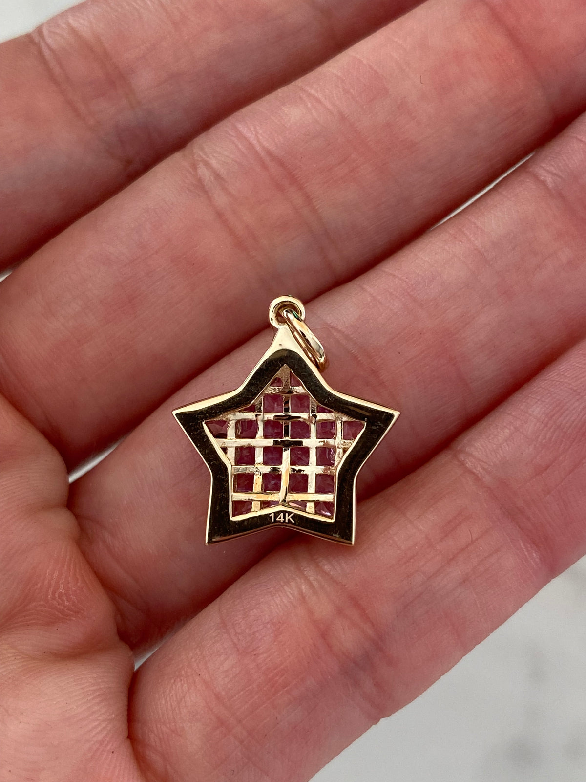 The WISH: 14k invisible set pink sapphire star pendant